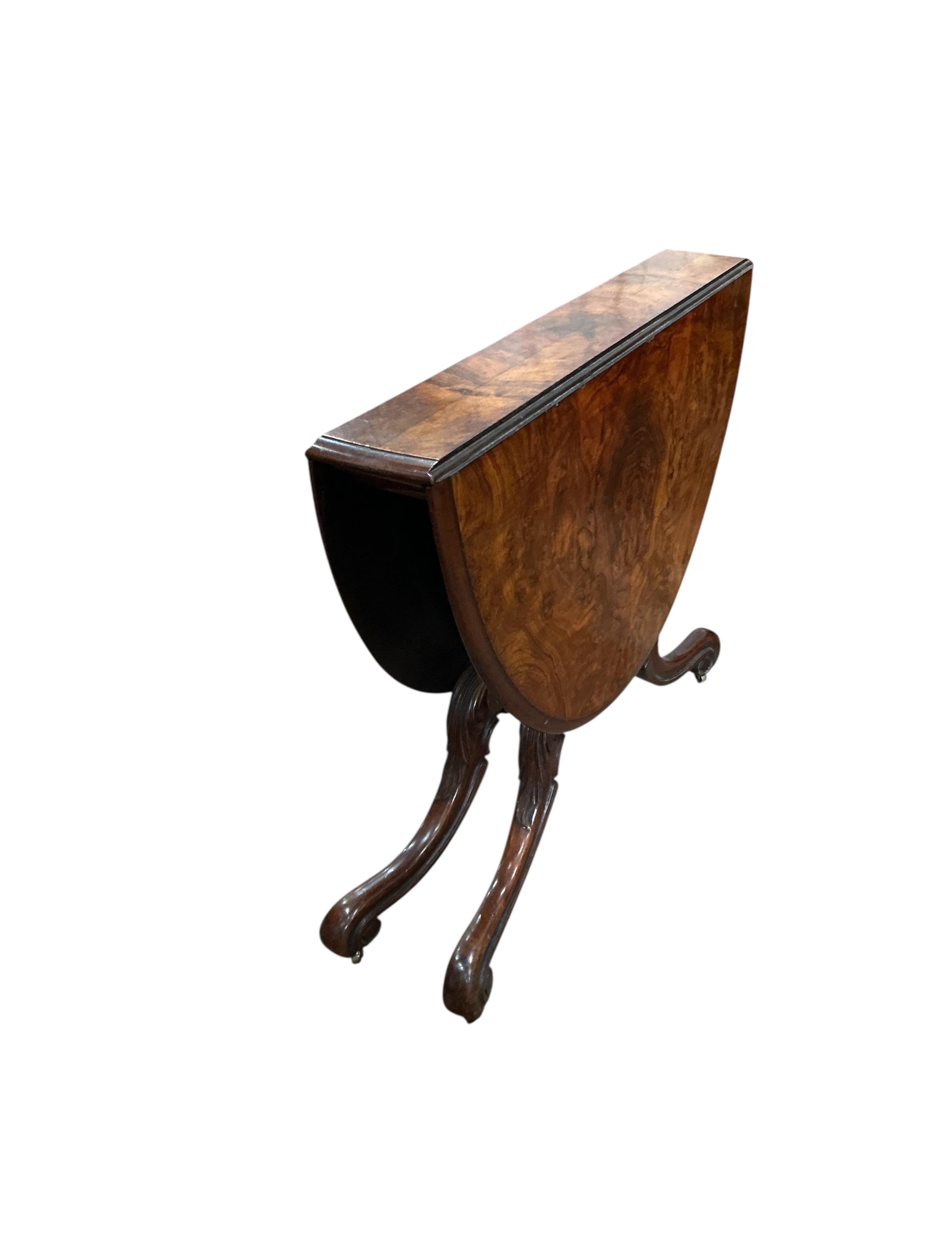 A Victorian burr walnut Sutherland table, width 91cm, height 73cm